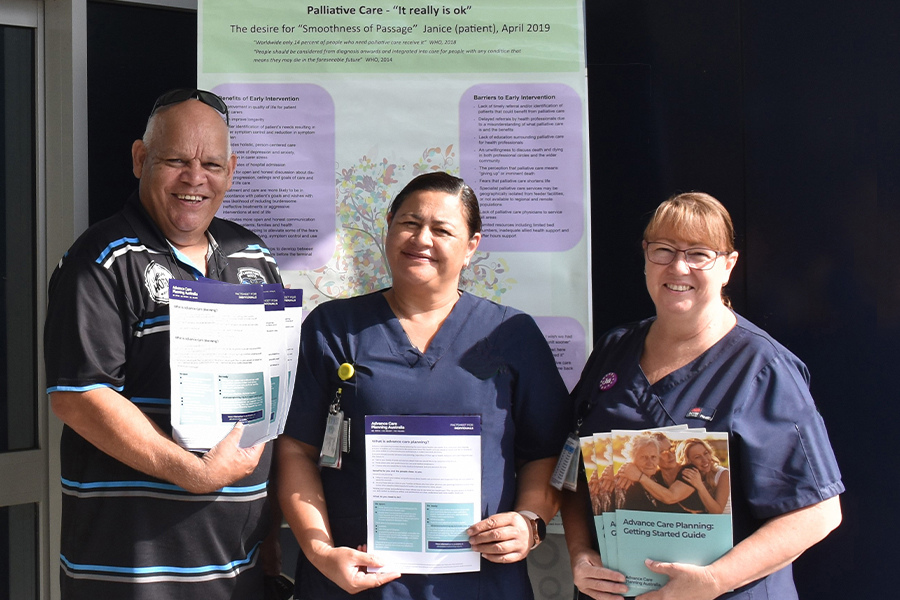 Three healthcare workers with information about advanced care planning