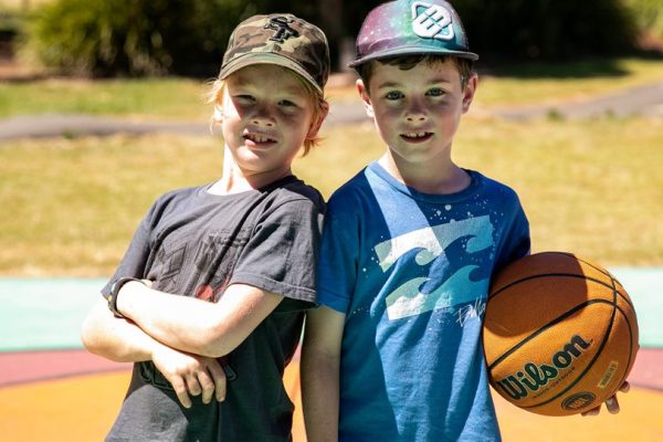 boys holding a basketball