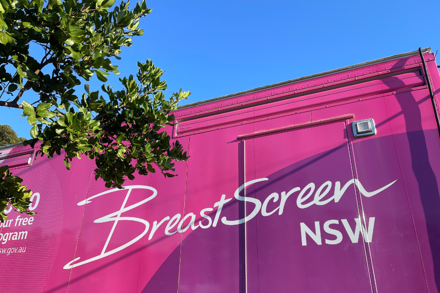 Side view of pink BreastScreen NSW tailer.
