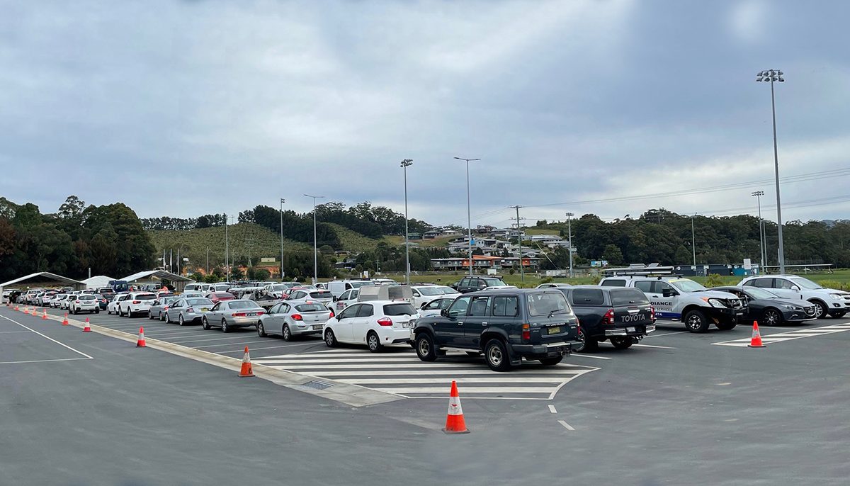 carpark full of cars in line for testing clinic