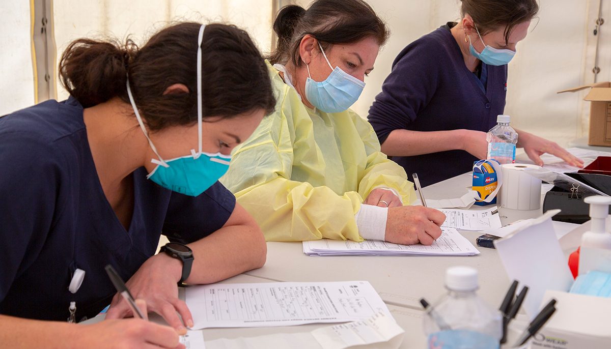 three women working on paperwork