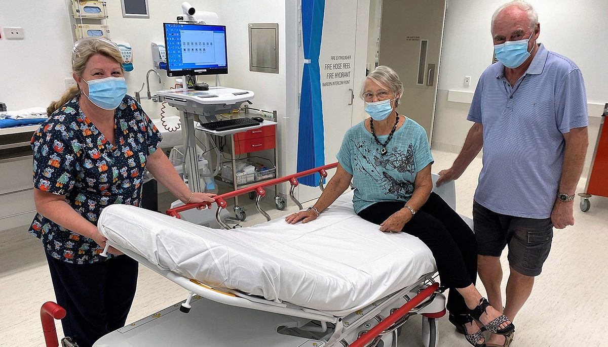 three people near a trauma bed