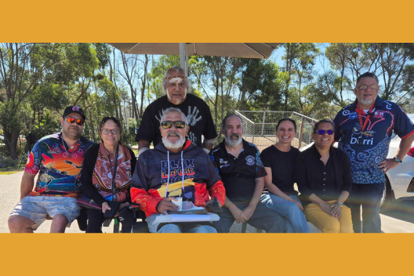 A group of Aboriginal stroke survivors smiling after filming an educational video.