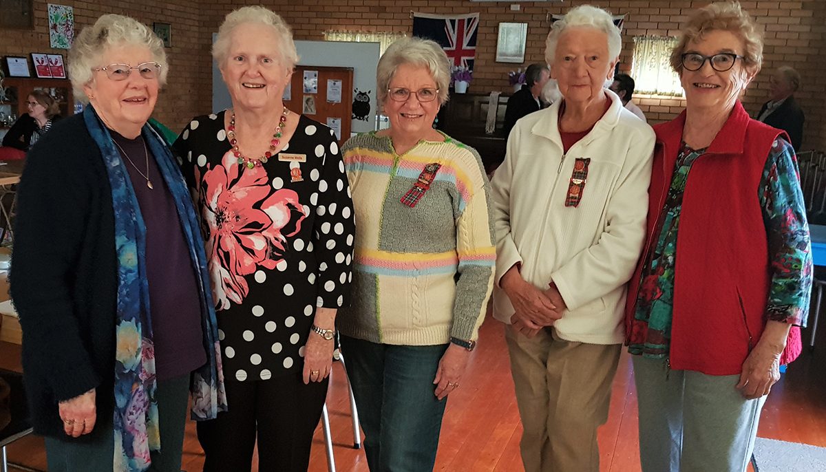 a group of older women standing together