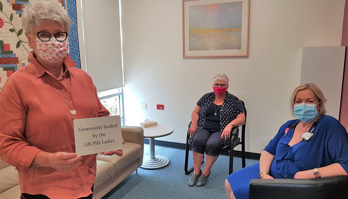 three ladies in a small room