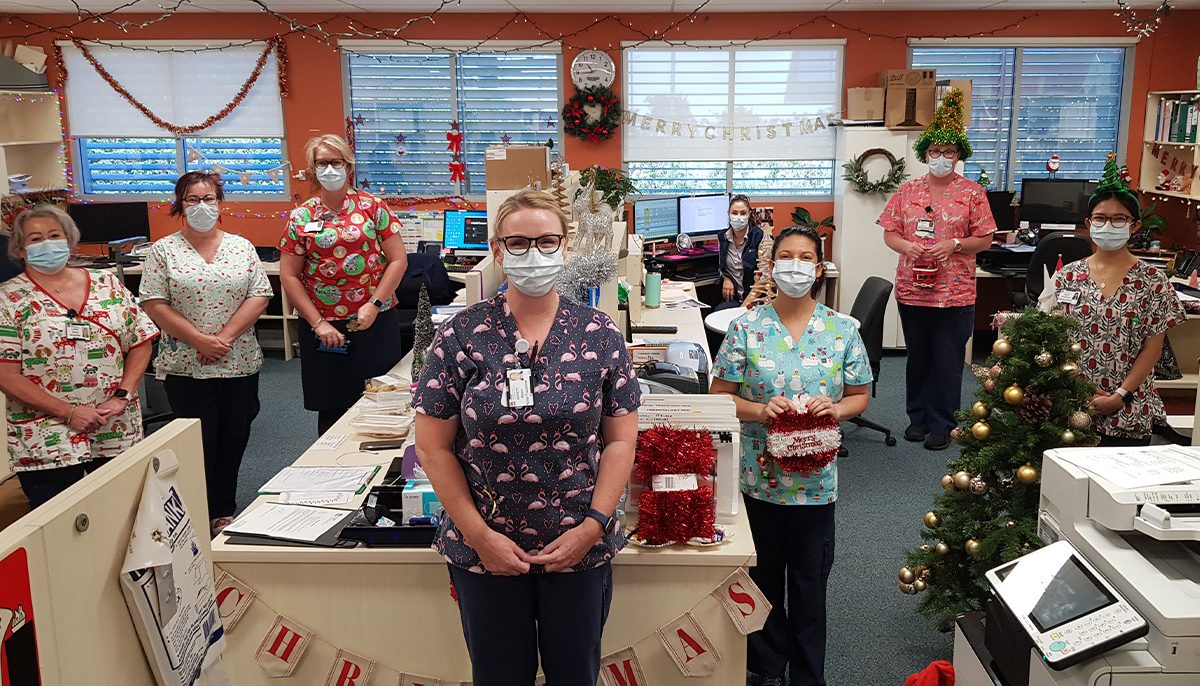 nurses standing in an office space