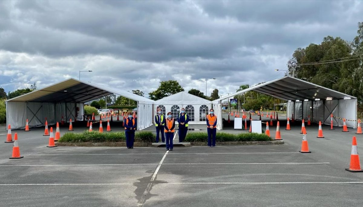 staff outside drive-through testing clinic