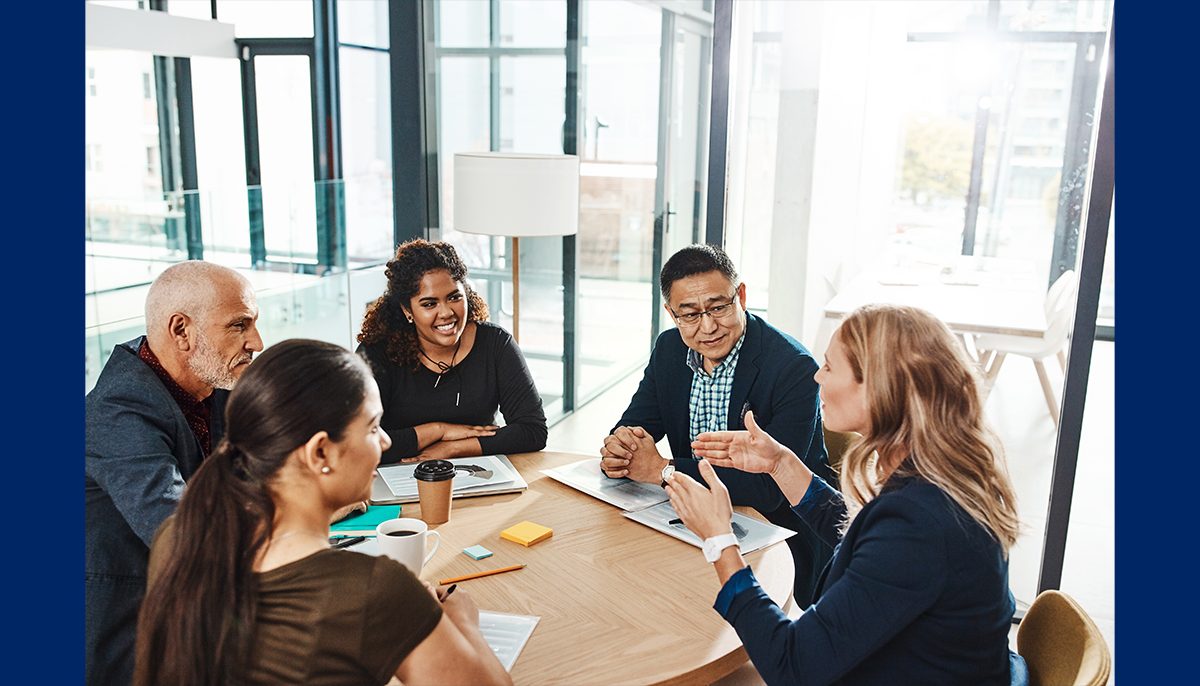 people sitting around a table talking