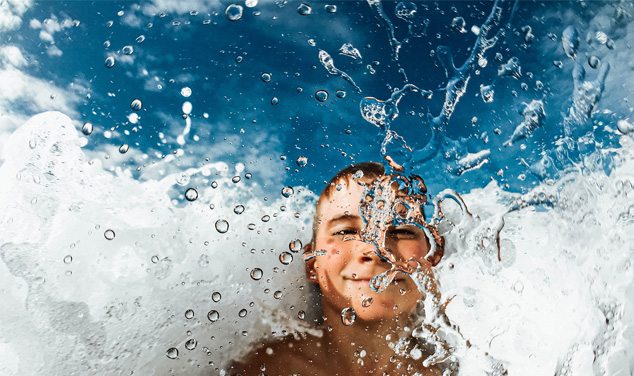 child splashing in water