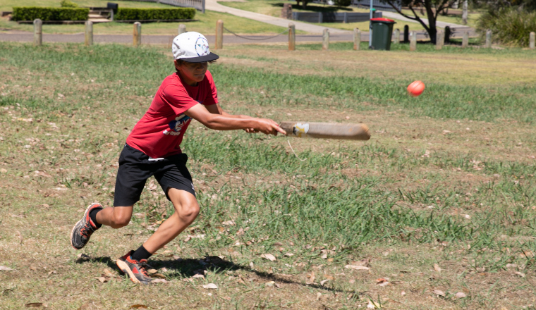 Child playing cricket