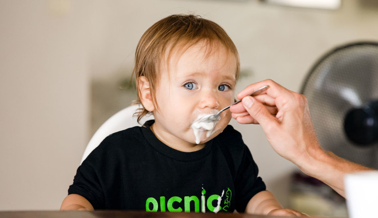 Child in highchair eating