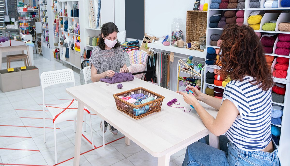 Women doing craft wearing masks