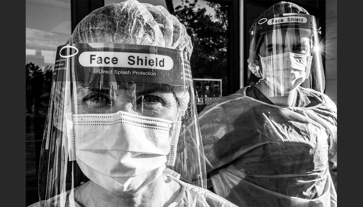 black and white image of nurses wearing masks